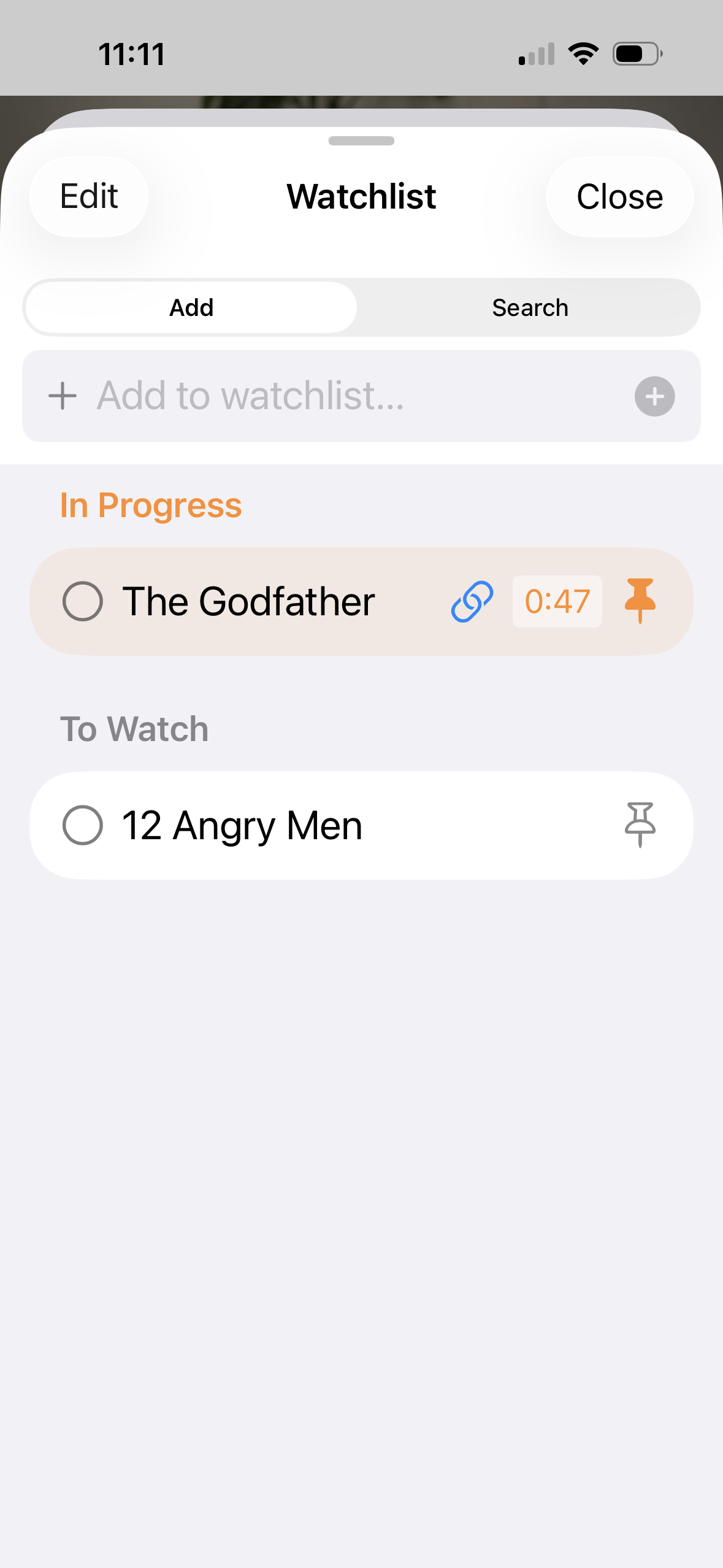 Mira's Watchlist on iPhone with pinned videos and progress tracking